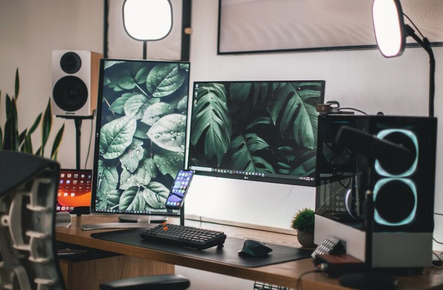 Black Flat Screen Computer Monitor on White Wooden Desk